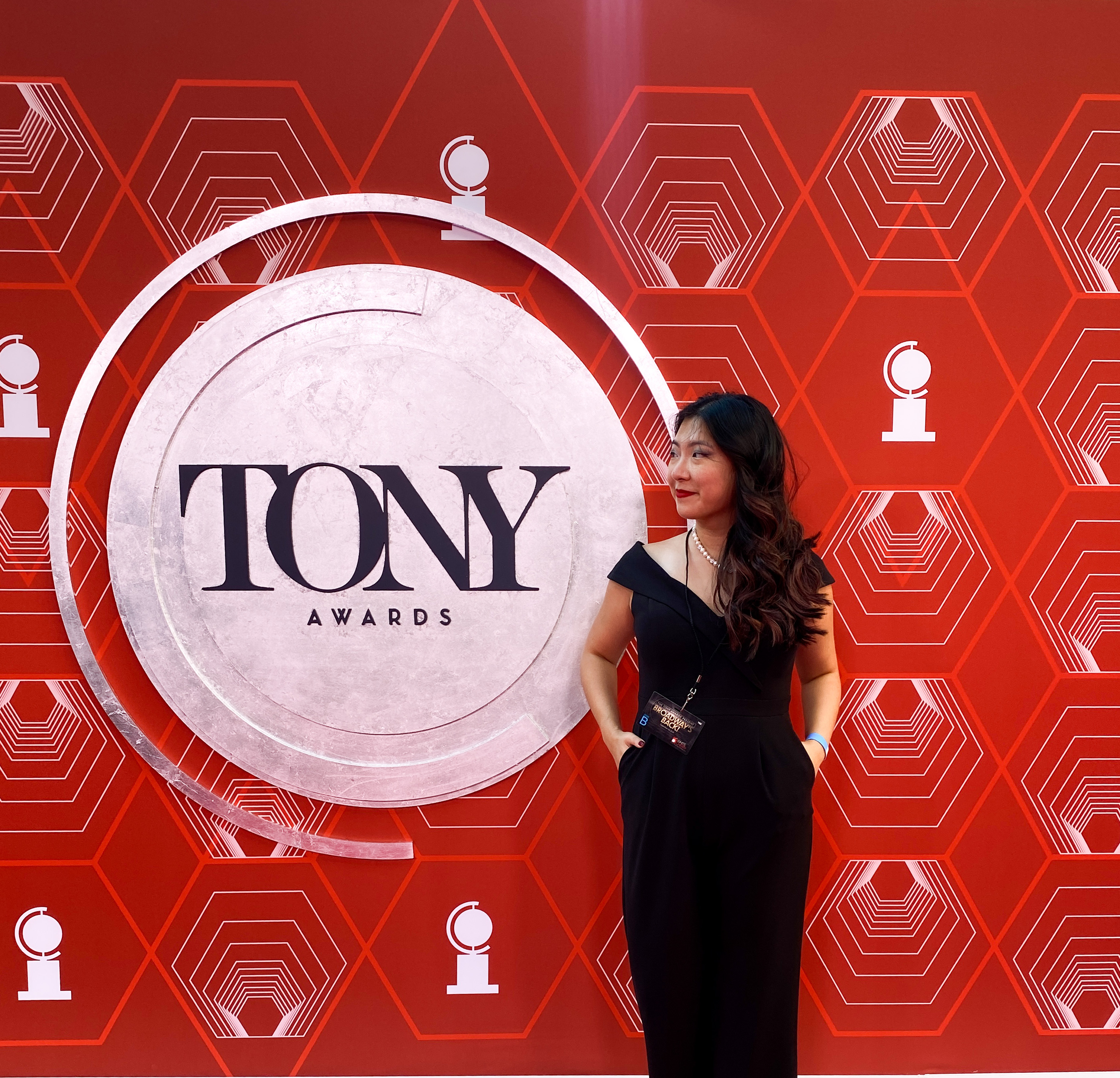 Kayla standing in front of Tony Awards sign