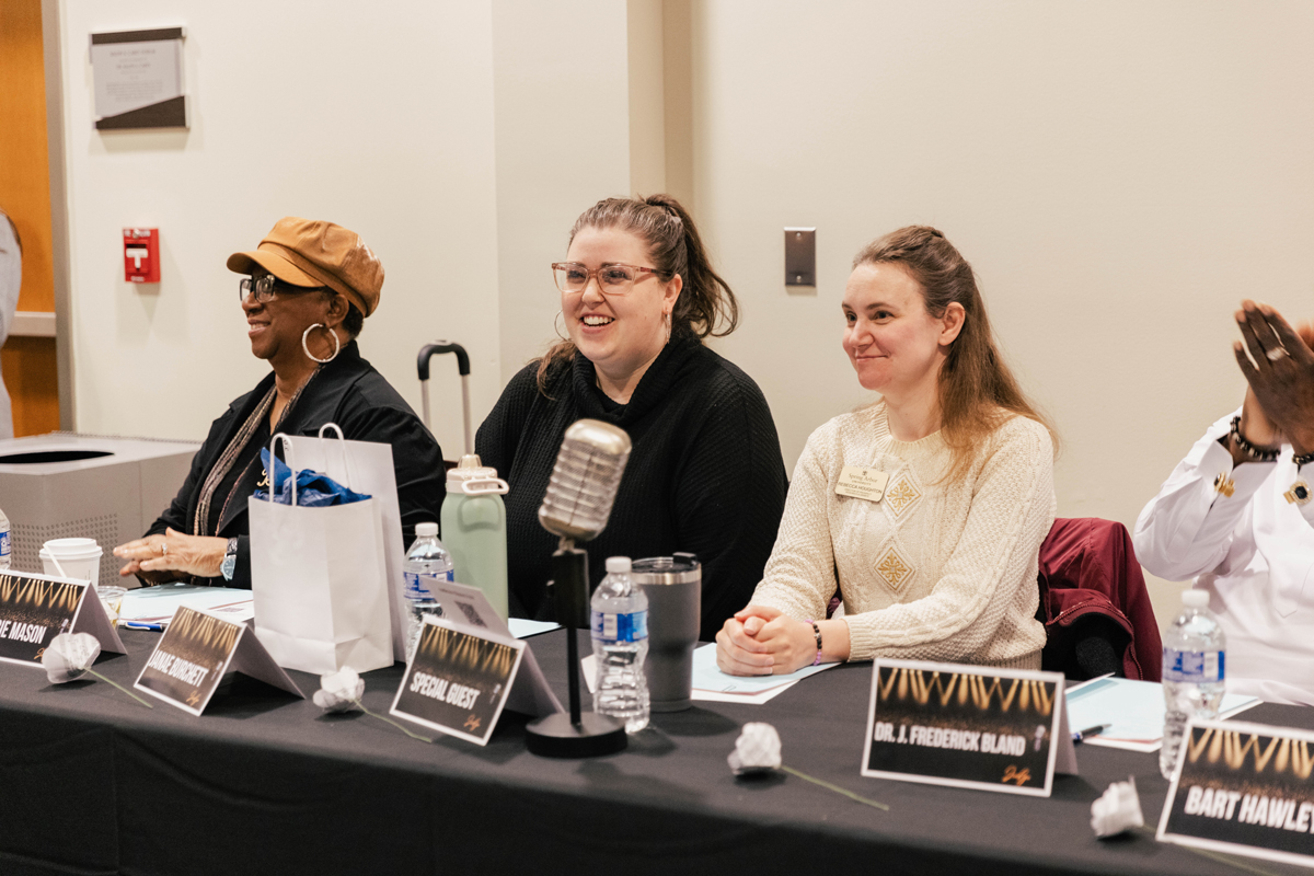 Babbie Mason Songwriting Competition, judges sitting at table clapping