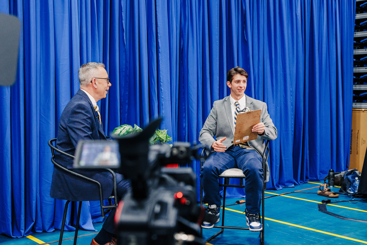 Student conducting an interview while at Evening at the Arbor.