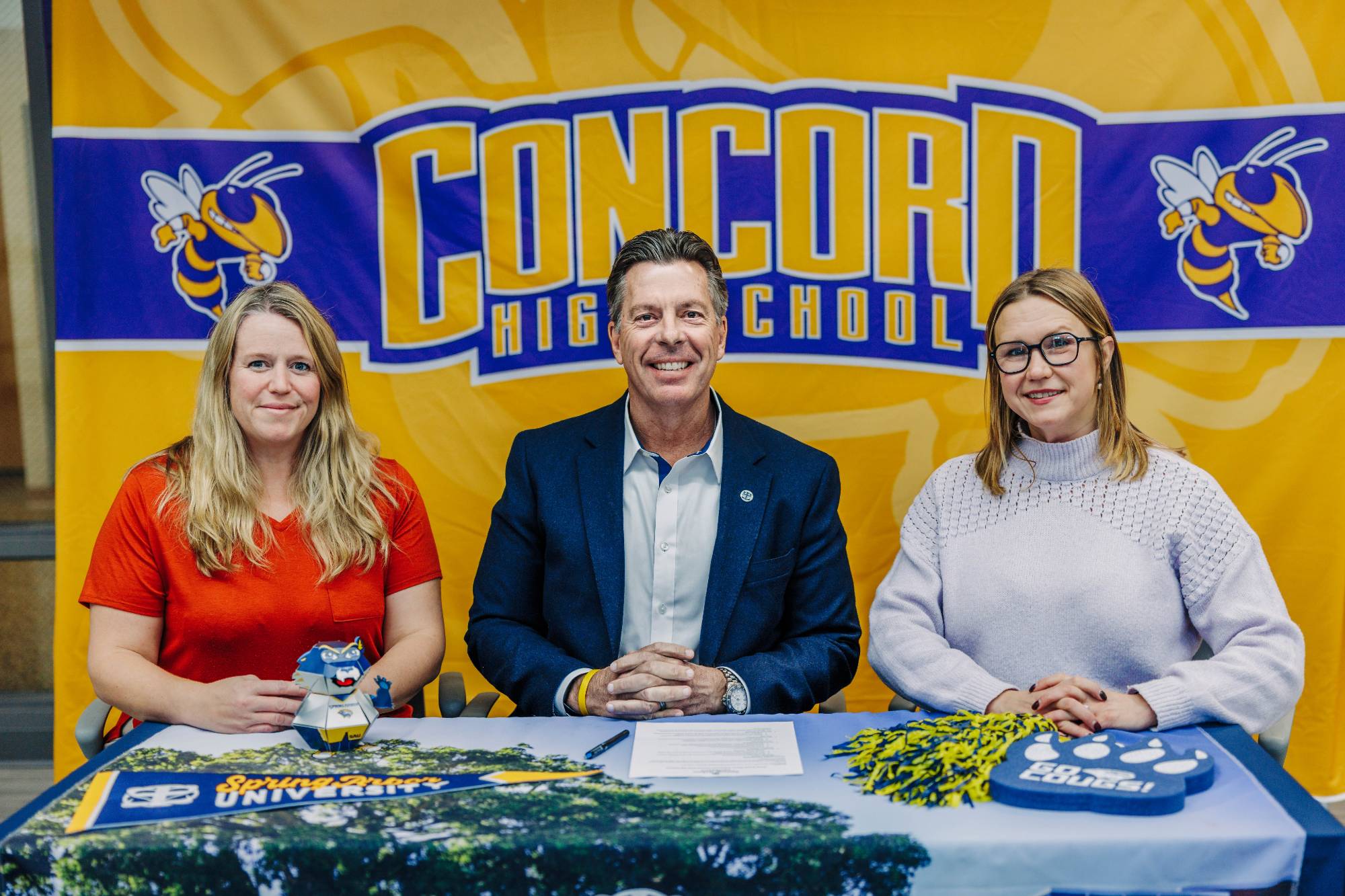 President Ellis with Concord Community Schools administrators agreeing to the Deep Roots Direct Admission partnership