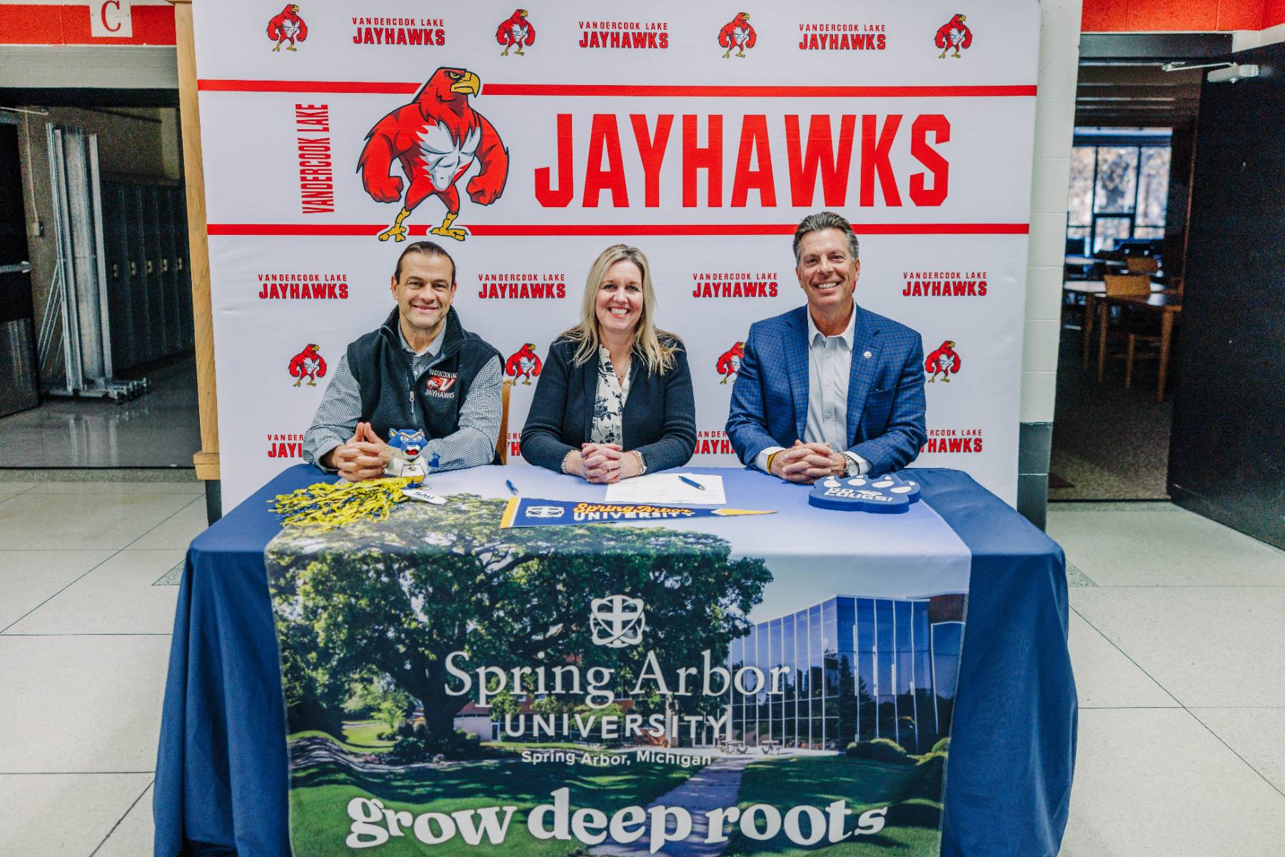 President Brent Ellis with Vandercook Lake Schools administrators to sign the Deep Roots Direct Admission program