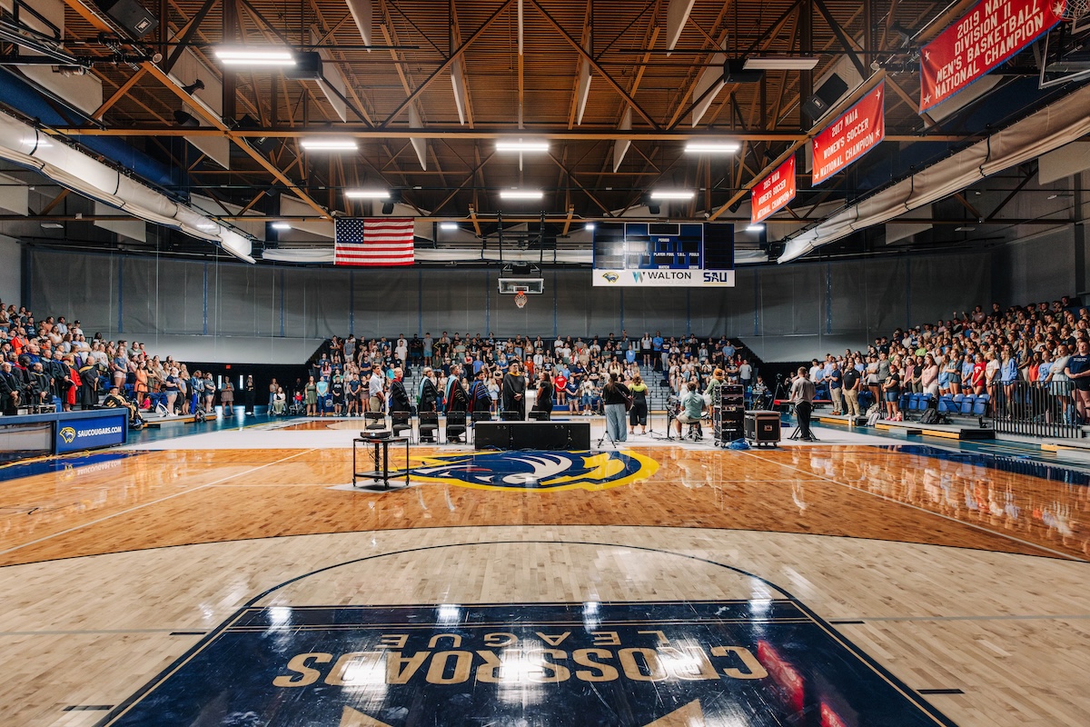 Students gathering in the McDonald Athletic Center (MAC) for chapel