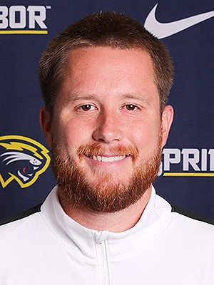 Headshot of Marco Bernardini in front of SAU Cougars Banner